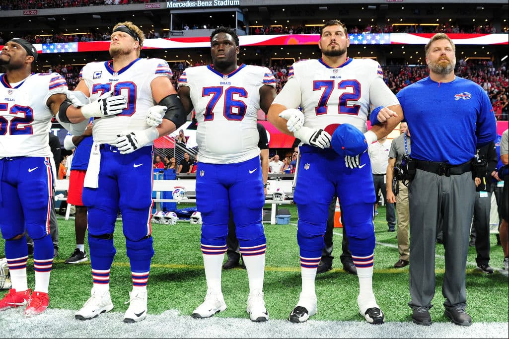 ATLANTA, GA - OCTOBER 01: Buffalo Bills players lock arms during the national anthem prior to the game against the Atlanta Falcons at Mercedes-Benz Stadium on October 1, 2017 in Atlanta, Georgia. (Photo by Scott Cunningham/Getty Images)