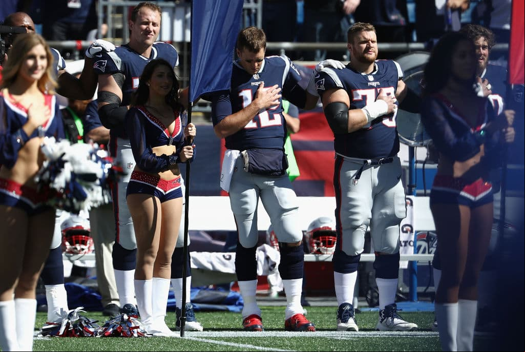 FOXBORO, MA - OCTOBER 01: Tom Brady #12 of the New England Patriots stands during the national anthem before the game between the Carolina Panthers and the New England Patriots at Gillette Stadium on October 1, 2017 in Foxboro, Massachusetts. (Photo by Maddie Meyer/Getty Images)