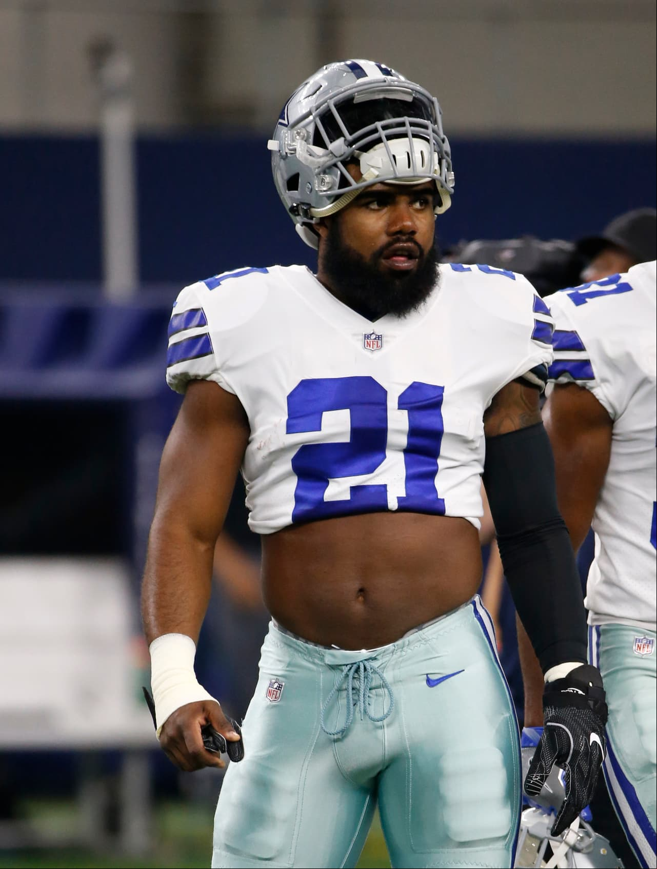 Dallas Cowboys running back Ezekiel Elliott (21) stands on the field during warm ups before a preseason NFL football game against the Oakland Raiders on Saturday, Aug. 26, 2017, in Arlington, Texas. (AP Photo/Ron Jenkins)