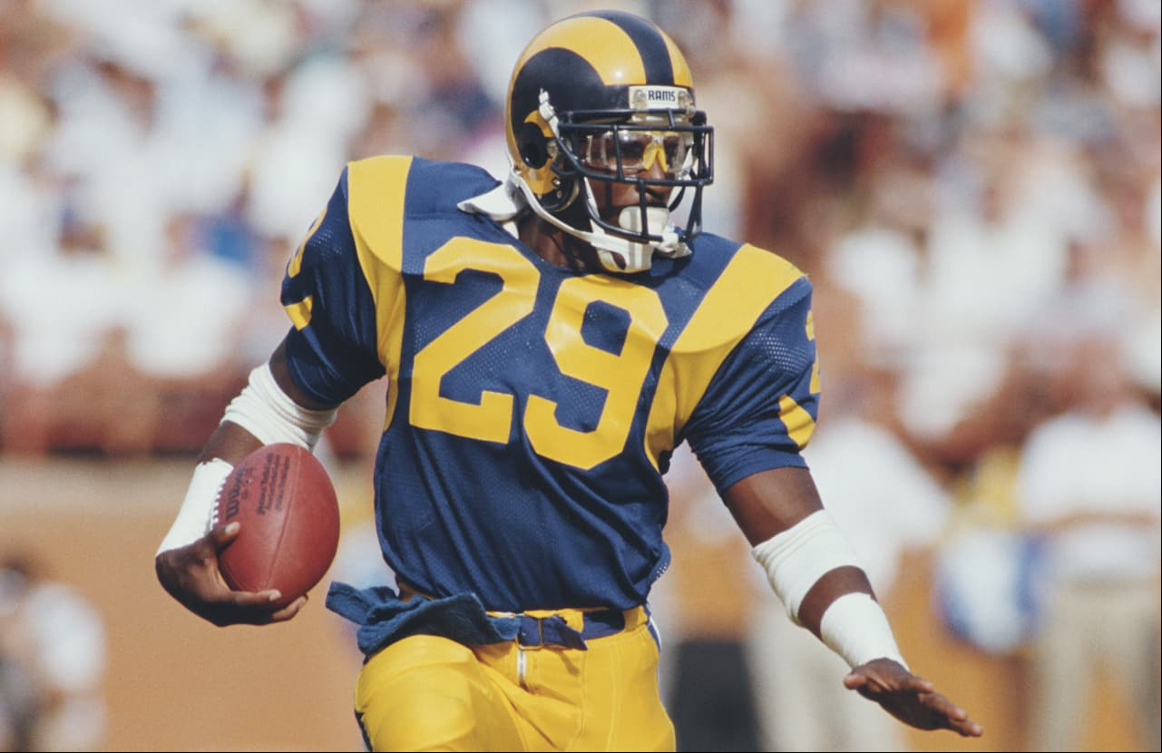 Eric Dickerson #29, Running back for the Los Angeles Rams runs the ball during the National Football Conference West game against the Detroit Lions on 19 October 1986 at the Anaheim Stadium, Anaheim, California, United States. The Rams won the game 14 - 10. (Photo by Rick Stewart/Allsport/Getty Images)